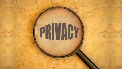 Alt Text: A microscope zooming in on the word “Privacy”